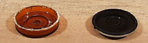 Bottom of pill bottle and speaker.