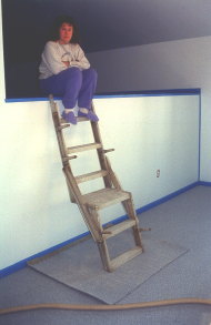 YMCA employee S. Agne surveys the completed rooms